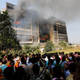Garment workers gather in front of the Standard Group garment factory which was on fire in Gazipur November 29, 2013.